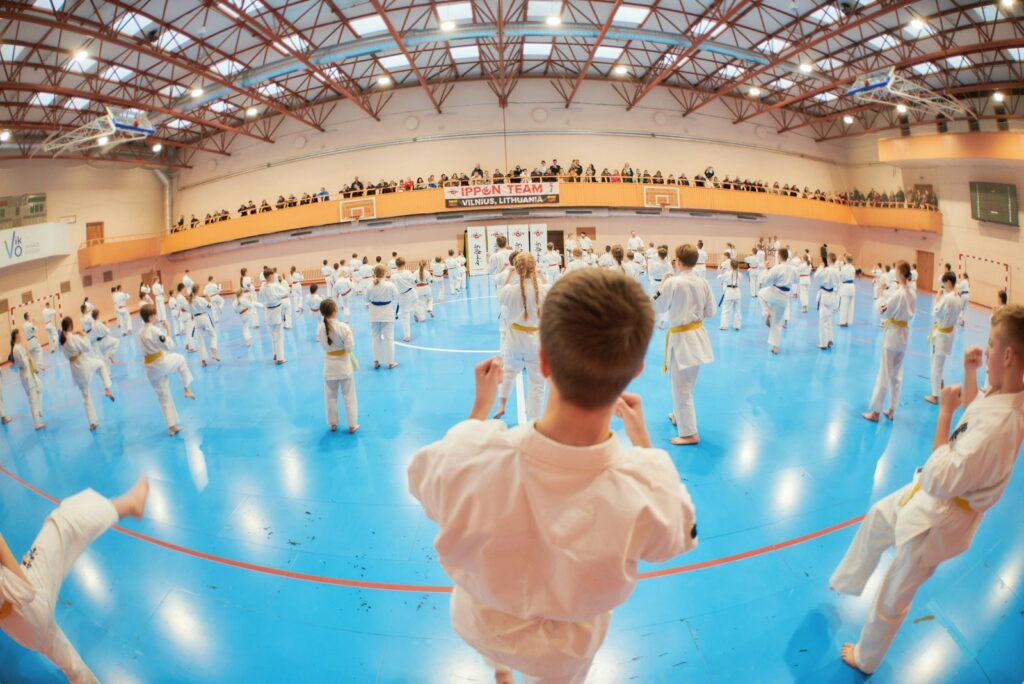 a group of people in a gym playing a game of karate